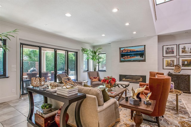 tiled living room featuring crown molding, a fireplace, and french doors