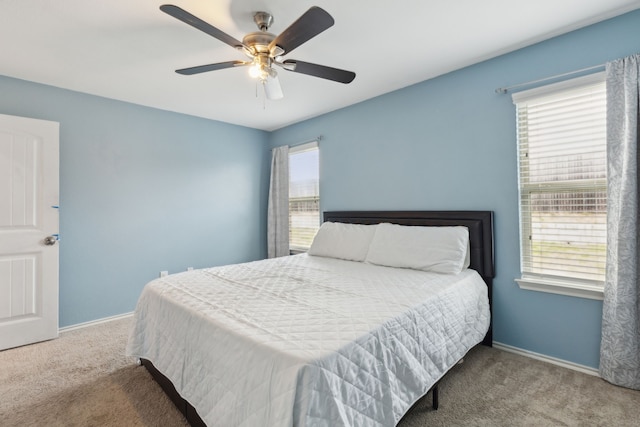 bedroom with light carpet and ceiling fan