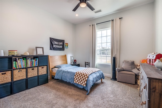 carpeted bedroom featuring visible vents, baseboards, a ceiling fan, and recessed lighting