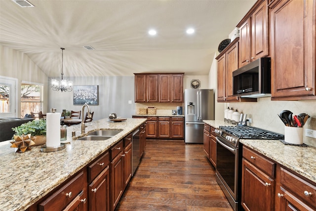 kitchen featuring appliances with stainless steel finishes, dark hardwood / wood-style floors, light stone countertops, and sink