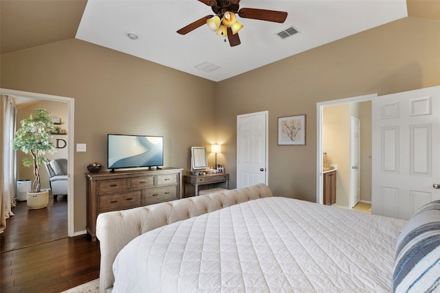 bedroom with vaulted ceiling, ceiling fan, and dark hardwood / wood-style flooring