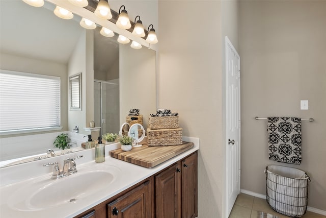 bathroom with vanity, tile patterned floors, and a shower with shower door