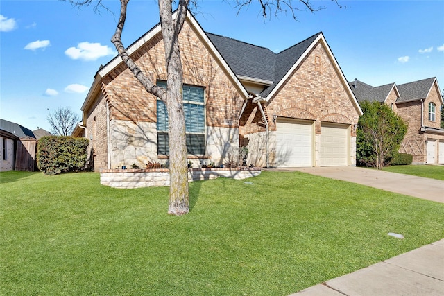 view of front of property featuring a garage and a front yard