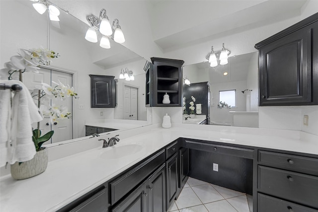 bathroom with tile patterned flooring and vanity