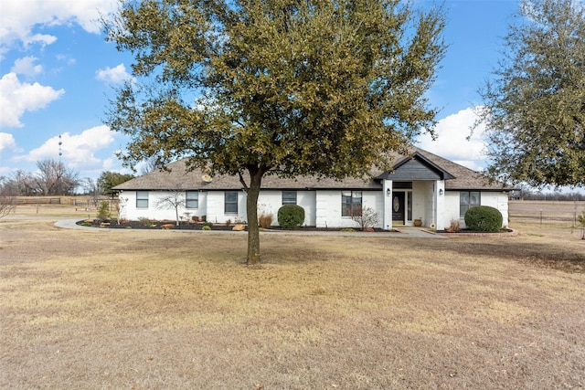 view of front of home with a front lawn