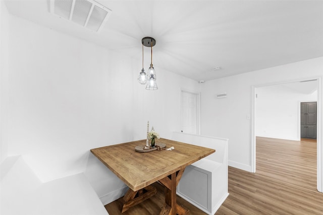 dining area with wood-type flooring