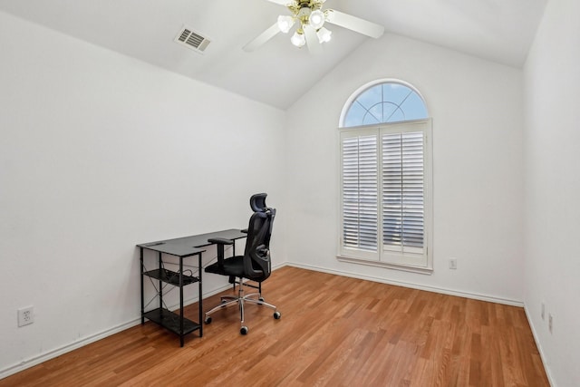 home office featuring ceiling fan, lofted ceiling, and light wood-type flooring