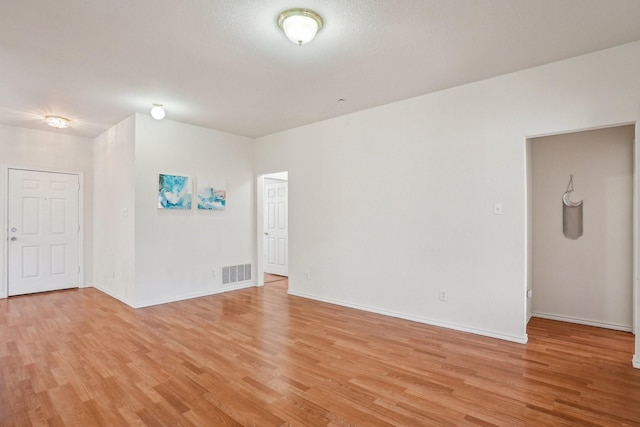 empty room with light wood-type flooring