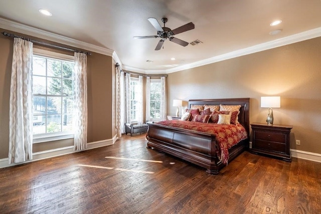 bedroom featuring multiple windows, crown molding, and dark wood-type flooring