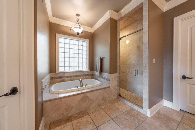 bathroom with tile patterned flooring, ornamental molding, and plus walk in shower