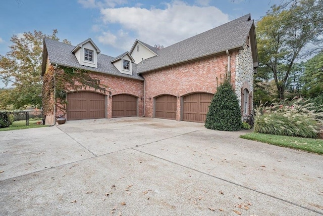 view of side of property with a garage