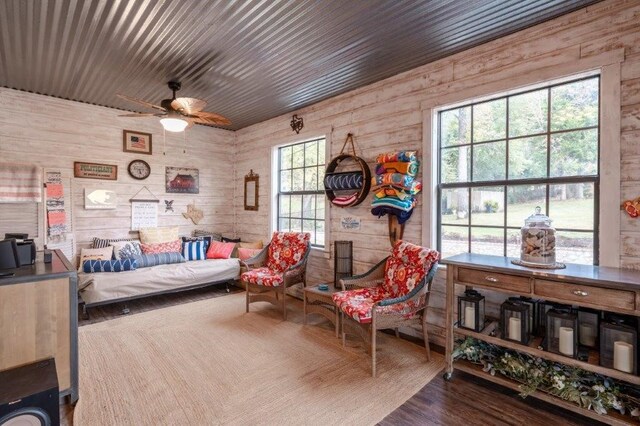 bedroom with wood-type flooring and wooden walls