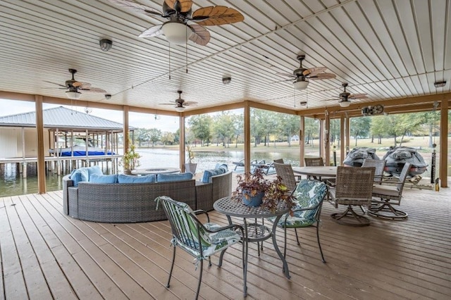 exterior space with a water view and ceiling fan