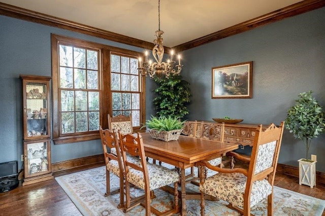 dining room with crown molding, dark wood-type flooring, and a wealth of natural light