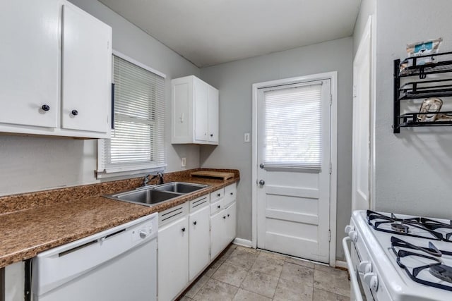 kitchen featuring white cabinetry, sink, white appliances, and a healthy amount of sunlight