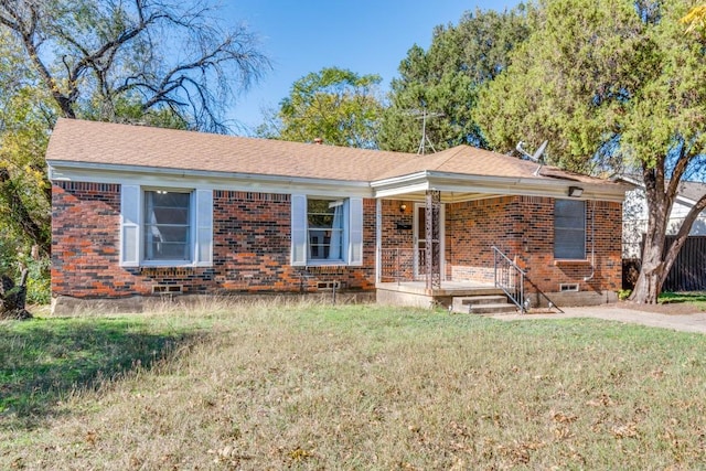 ranch-style home featuring a front lawn