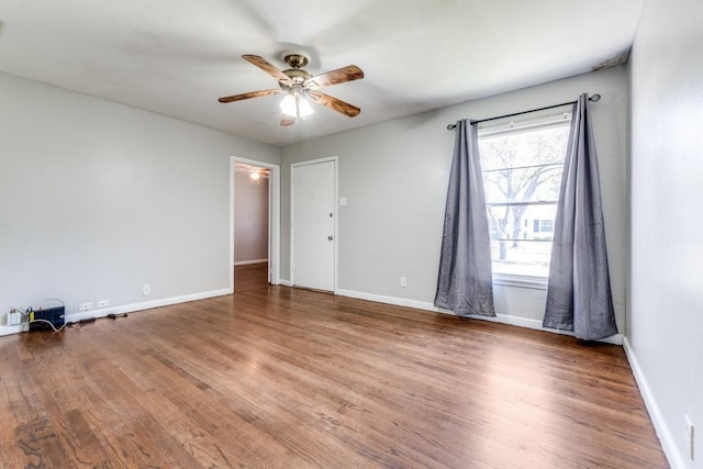 spare room featuring hardwood / wood-style flooring and ceiling fan