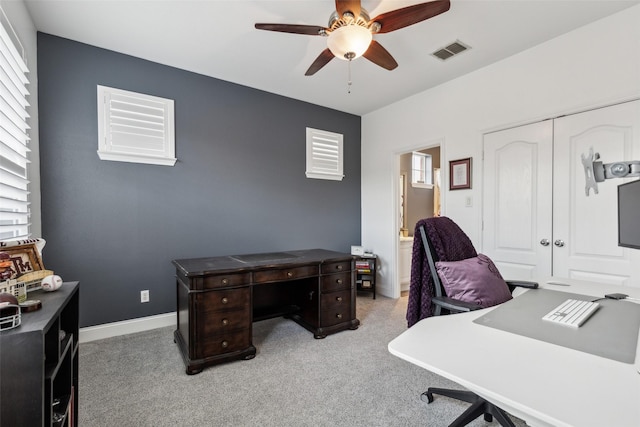 office area featuring light colored carpet and ceiling fan