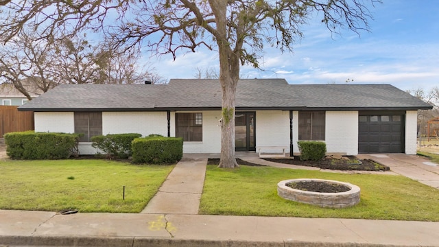 ranch-style home with a garage and a front lawn