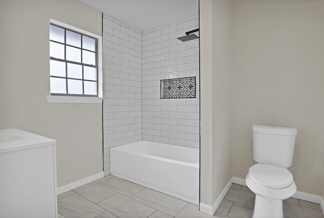 bathroom with toilet, tile patterned floors, baseboards, and shower / bathing tub combination