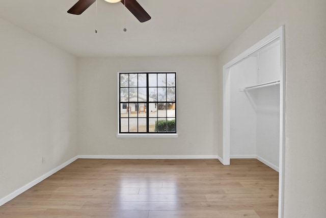 unfurnished bedroom featuring light wood-style flooring and baseboards