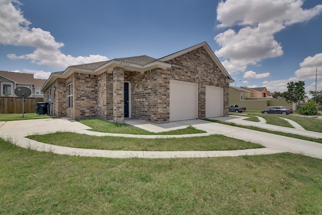 view of front of property featuring a garage and a front lawn