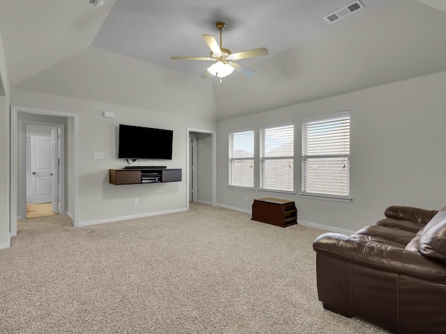 living room with ceiling fan, vaulted ceiling, and light carpet