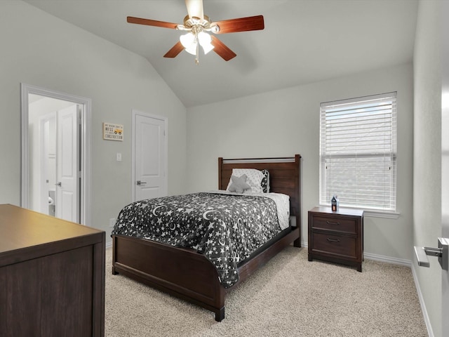 carpeted bedroom featuring ceiling fan and vaulted ceiling