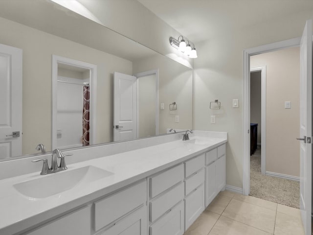 bathroom with vanity and tile patterned flooring