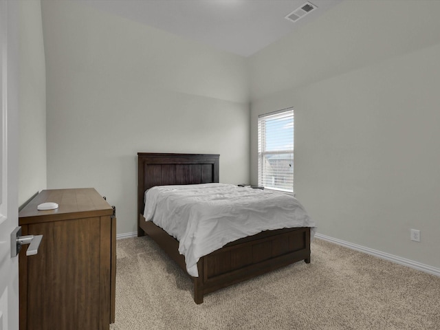 bedroom with light carpet