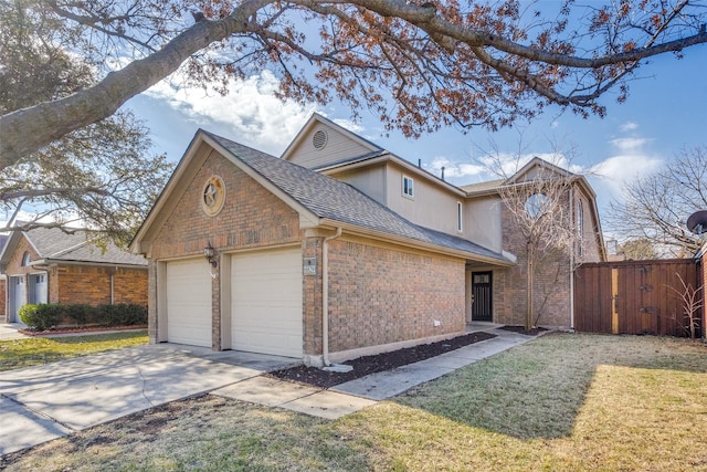 view of front facade featuring a garage and a front yard