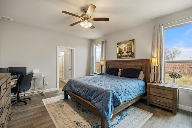 bedroom featuring dark hardwood / wood-style floors and ceiling fan