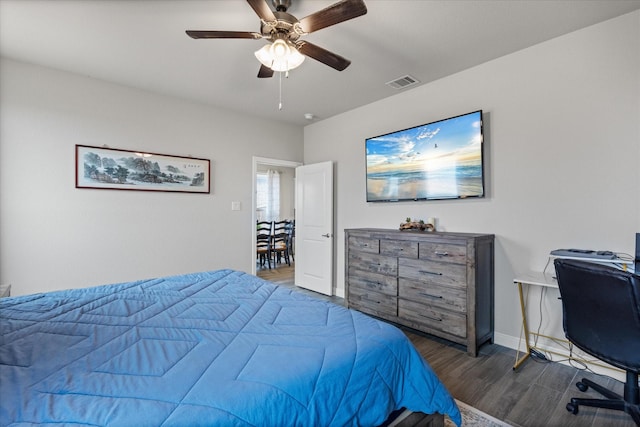 bedroom featuring ceiling fan and dark hardwood / wood-style floors