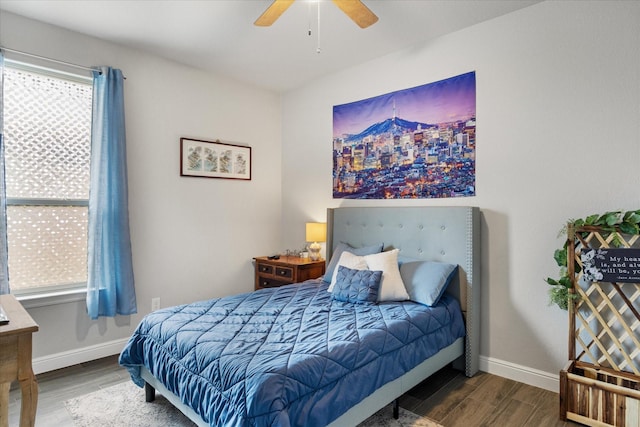 bedroom with wood-type flooring and ceiling fan