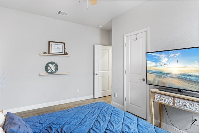 bedroom featuring ceiling fan and hardwood / wood-style floors