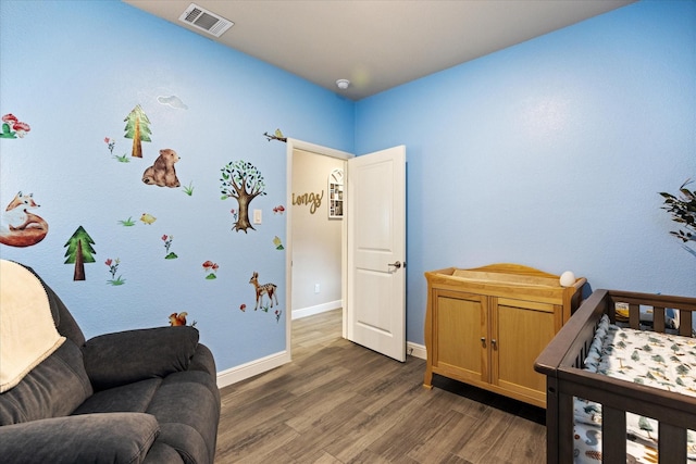 bedroom with dark wood-type flooring