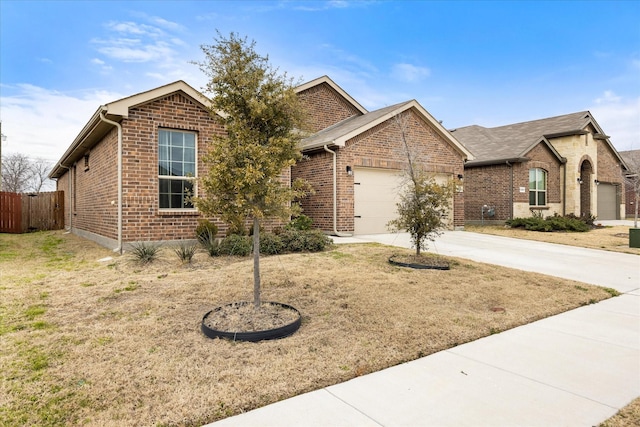 view of front of home featuring a garage and a front lawn