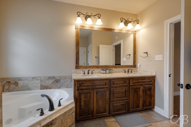 bathroom featuring tile patterned flooring, vanity, and tiled bath