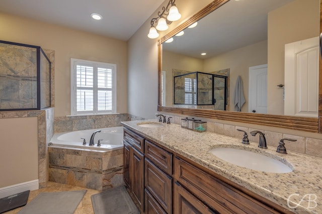 bathroom with shower with separate bathtub and vanity