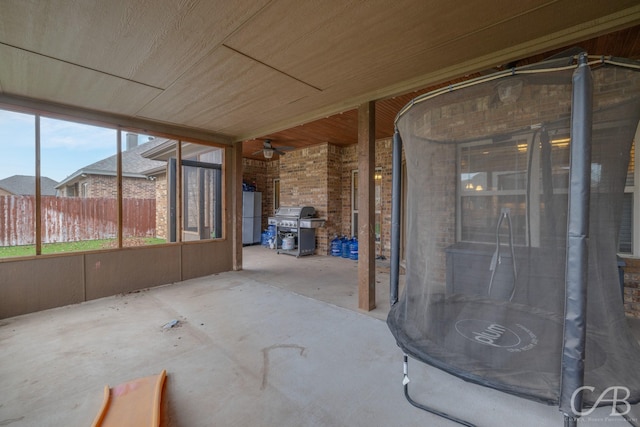 unfurnished sunroom featuring wooden ceiling