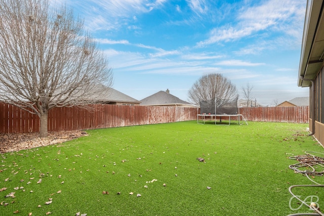 view of yard with a trampoline