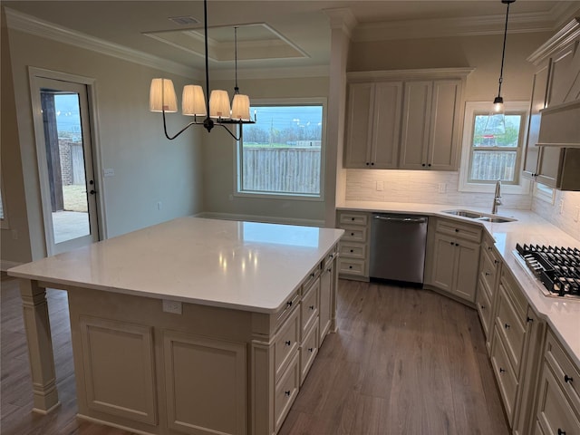 109 Katy Ln, Bossier City, LA 71111 - kitchen with a sink, backsplash, wood finished floors, stainless steel appliances, and crown molding