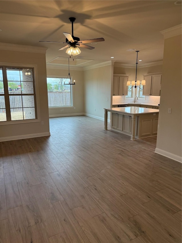 109 Katy Ln, Bossier City, LA 71111 - unfurnished living room featuring a sink, crown molding, baseboards, and wood finished floors