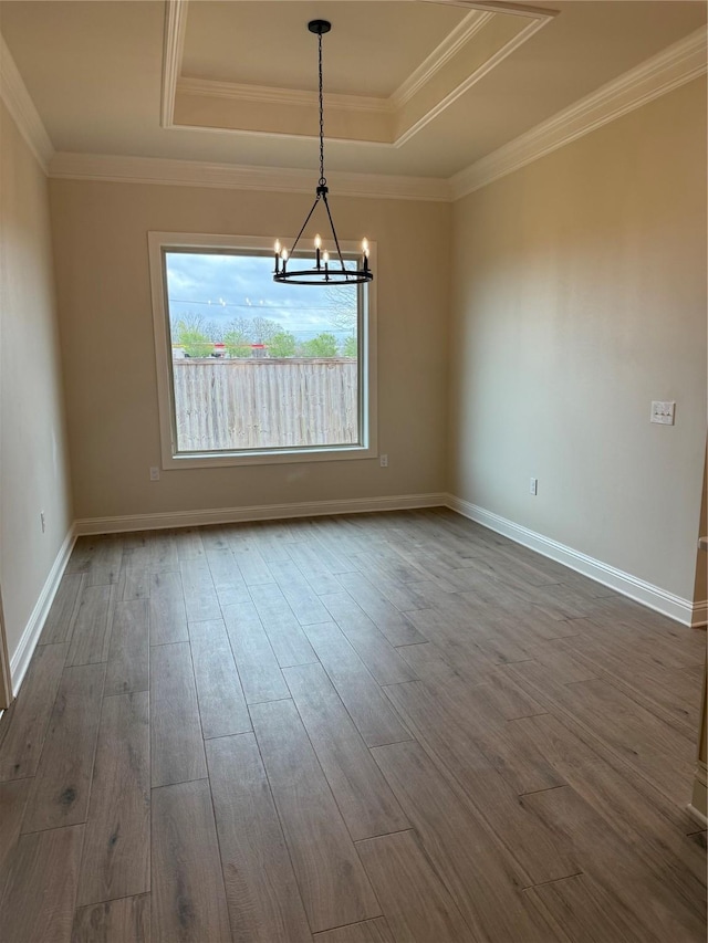109 Katy Ln, Bossier City, LA 71111 - unfurnished room featuring dark wood finished floors, a raised ceiling, and a chandelier