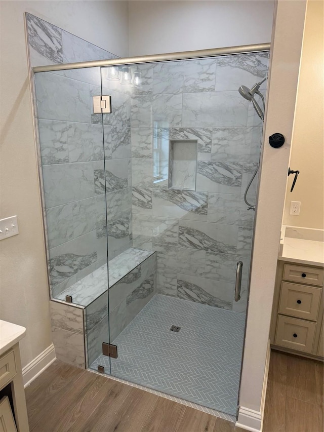 109 Katy Ln, Bossier City, LA 71111 - full bathroom featuring vanity, wood finished floors, a stall shower, and baseboards