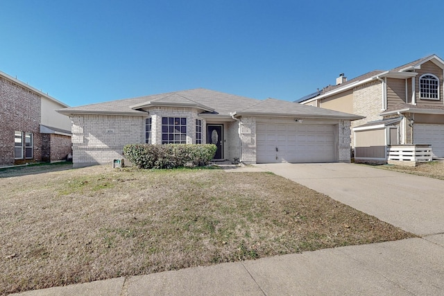 ranch-style home featuring a garage and a front yard