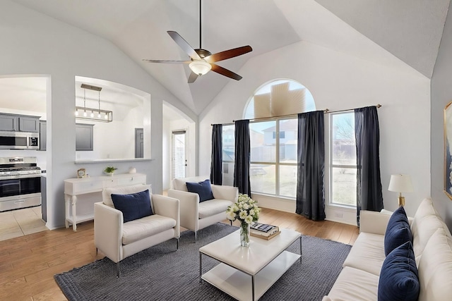 unfurnished living room with ceiling fan, a textured ceiling, a fireplace, and a tray ceiling