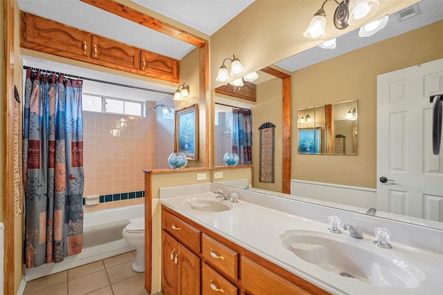 full bathroom featuring tile patterned flooring, vanity, toilet, and shower / tub combo with curtain