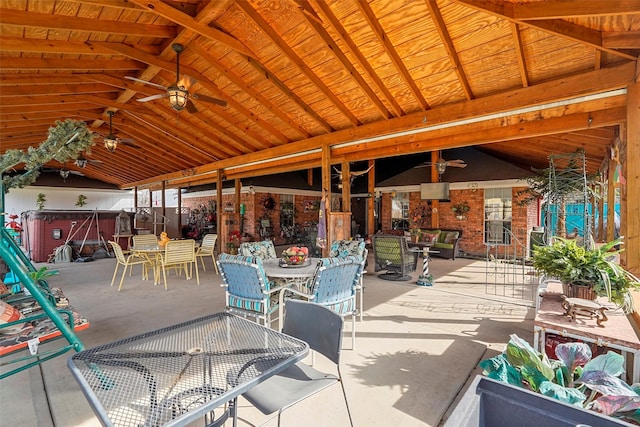 view of patio / terrace featuring ceiling fan and a hot tub