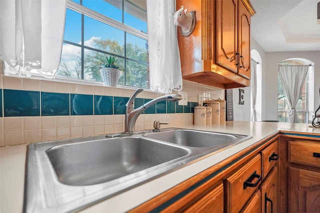 kitchen featuring sink and decorative backsplash